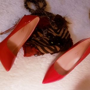 Genshuo's alluring 5-inch red lacquer stiletto heels. Size 9